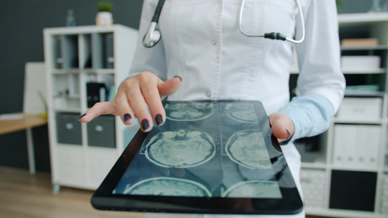 Doctor reviewing data on a tablet in the practice